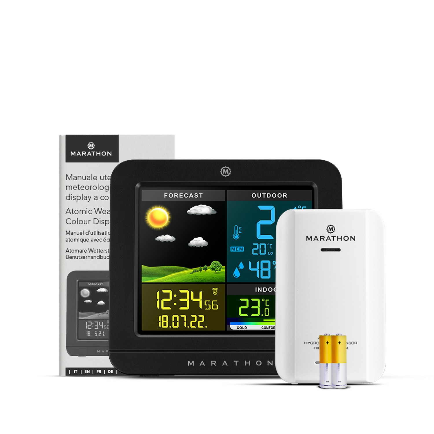A black weather station with a white sensor and a manual, and batteries on white surface.