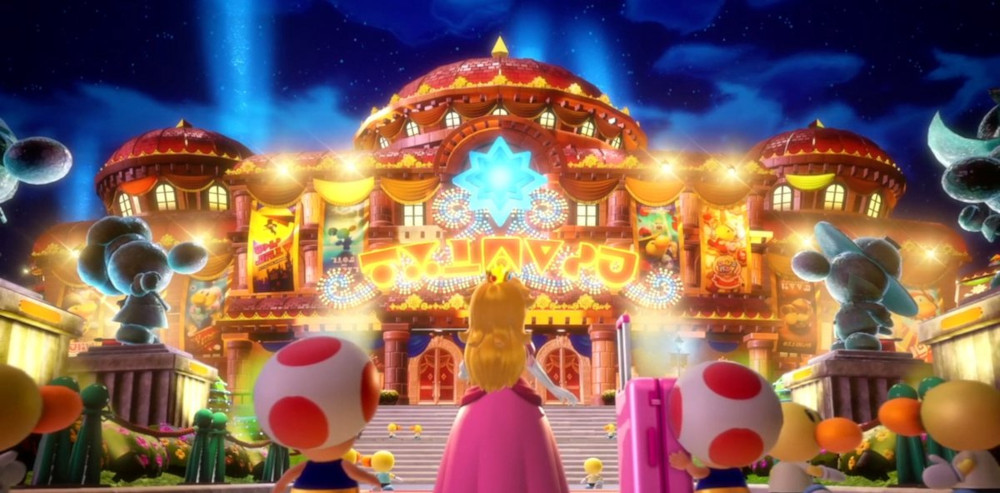 Een kleurrijk, verlicht podium met personages en gebouwen in een videogame scène.