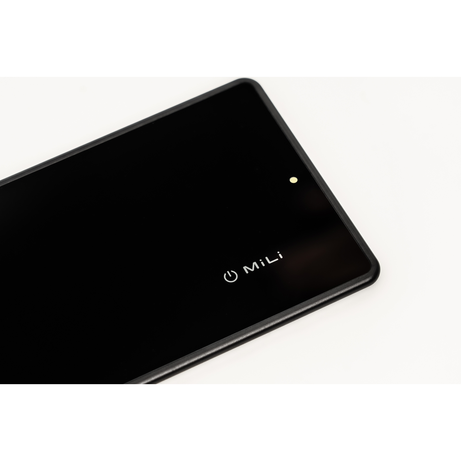 A black tablet with a white logo and power button, on a white background.