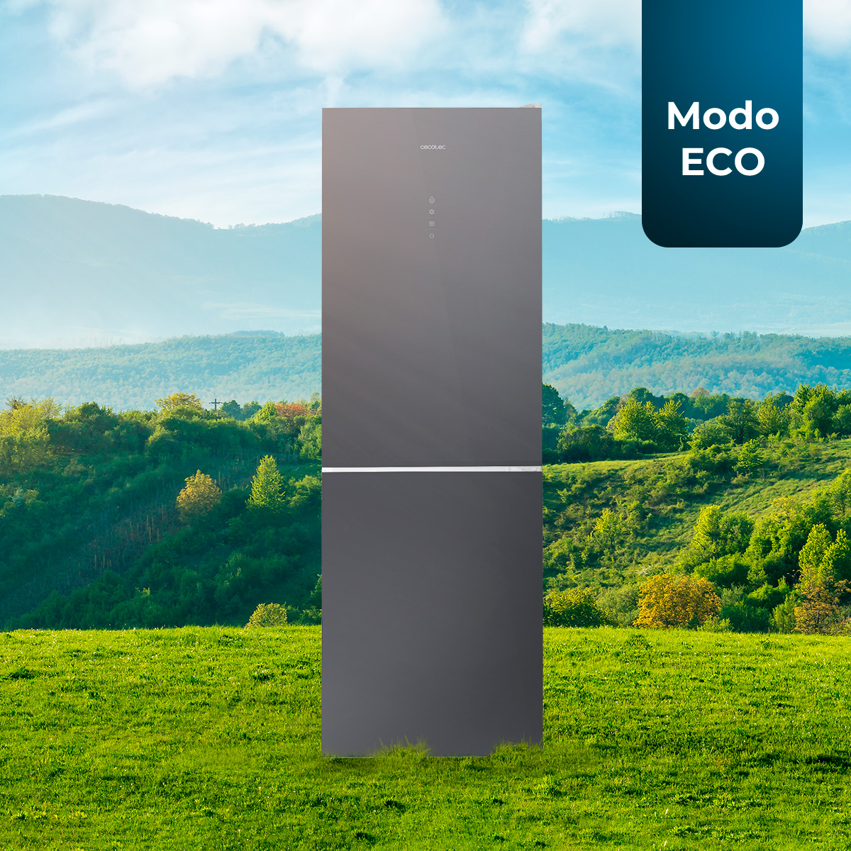 Un refrigerador gris, con un campo verde y montañas en el fondo.