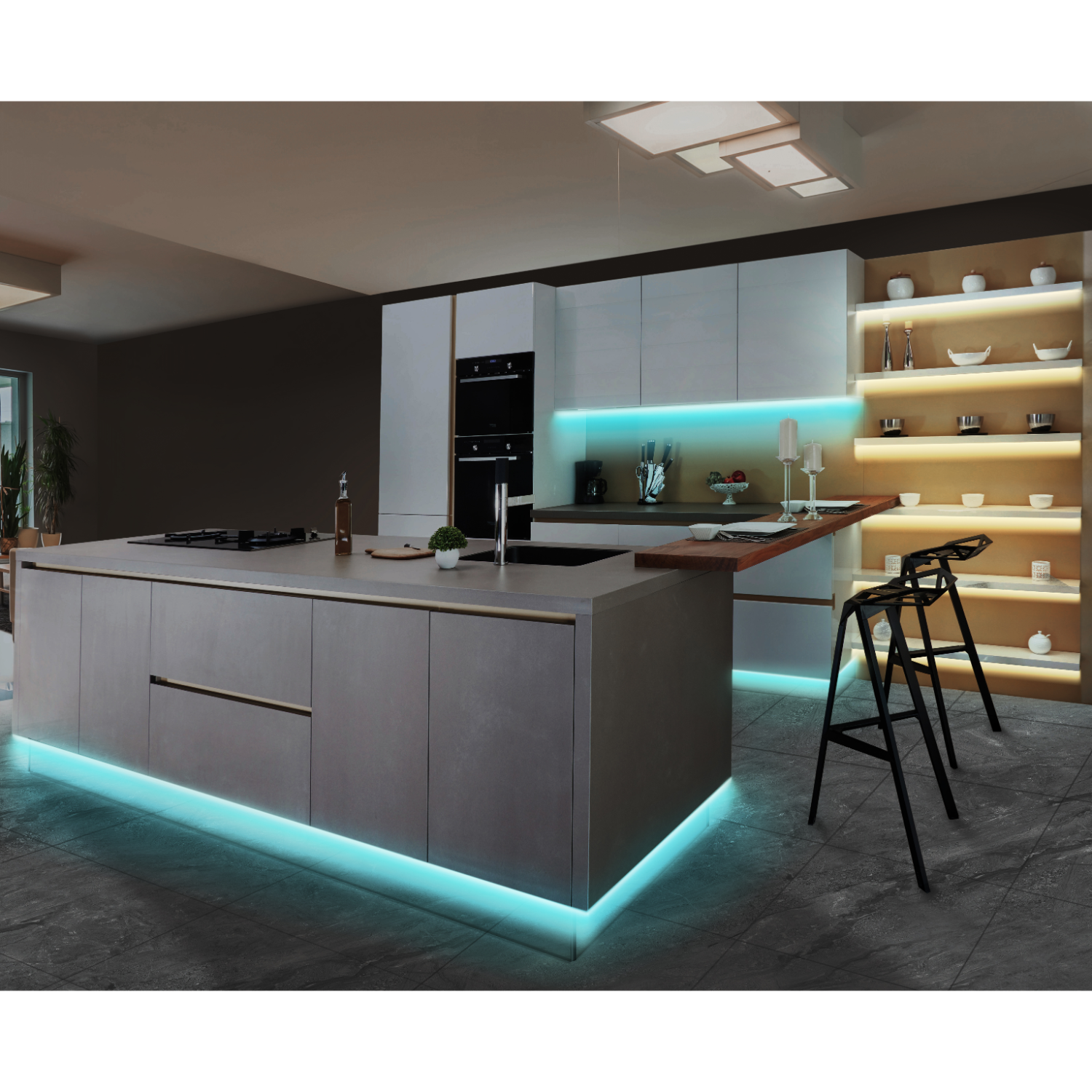 Modern kitchen with an island and overhead lighting. Blue LED lights under the island and cabinets.