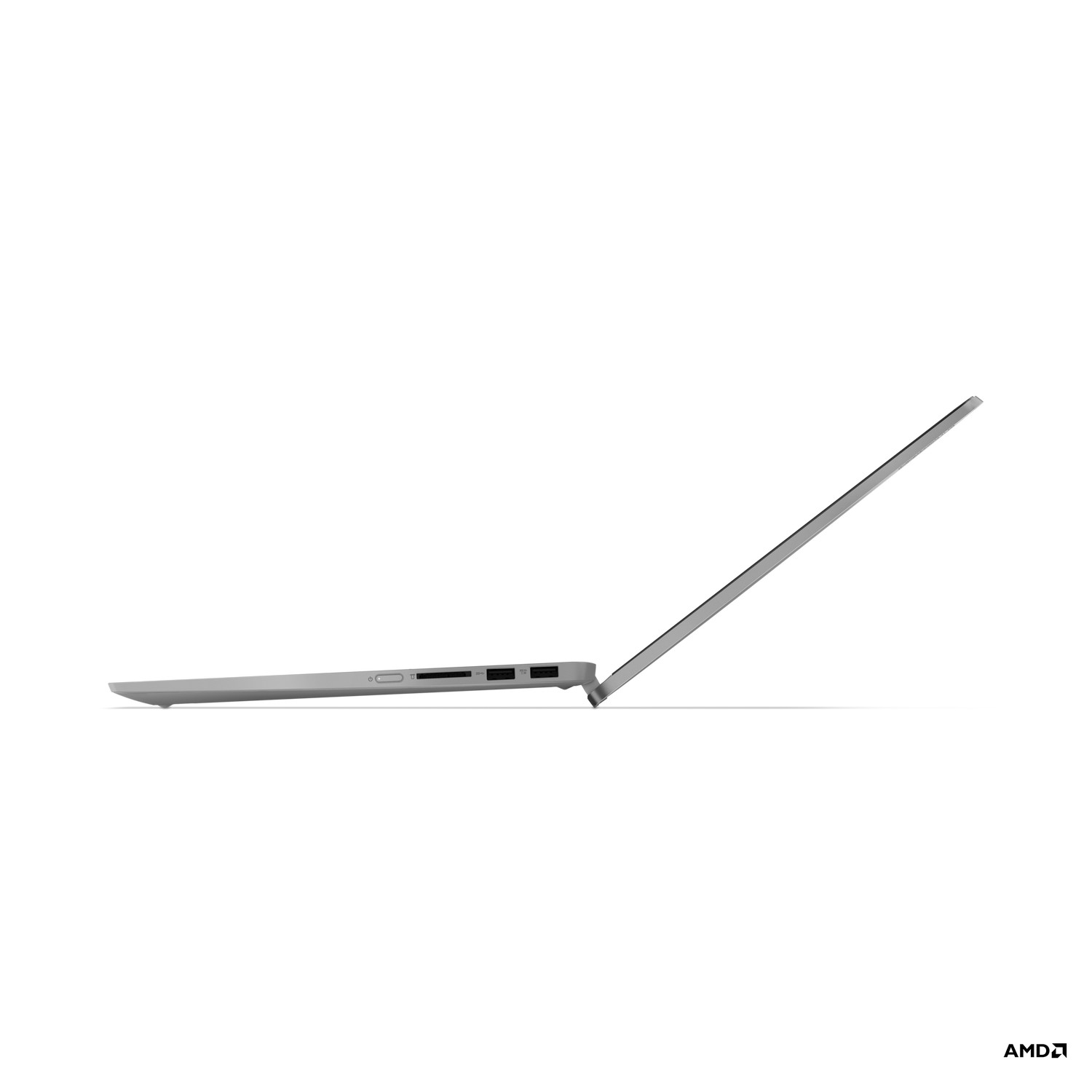 Un ordinateur portable argenté ouvert en angle, montrant le profil latéral, avec le logo AMD en bas.