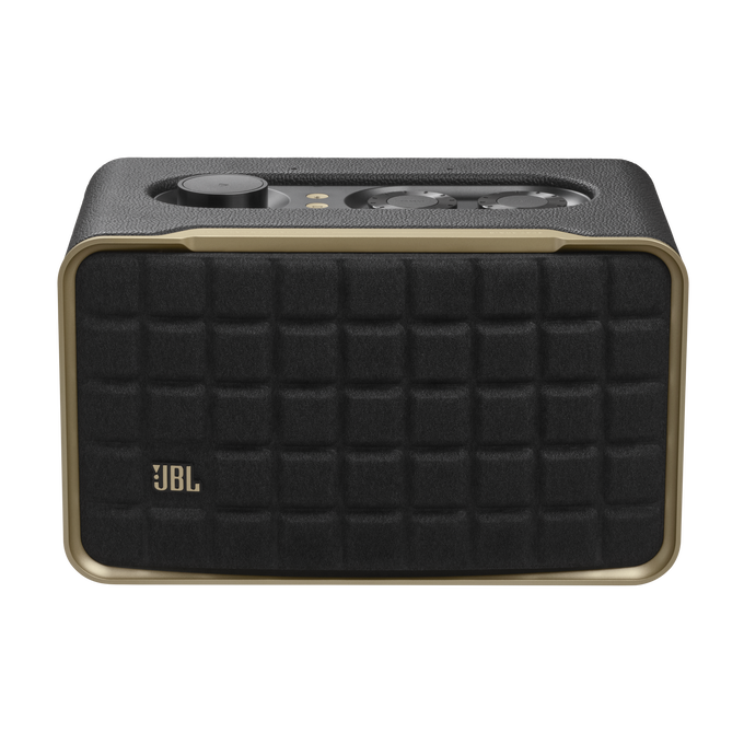 Un altavoz JBL negro, dispositivo cuadrado con borde dorado y rejilla de altavoz.