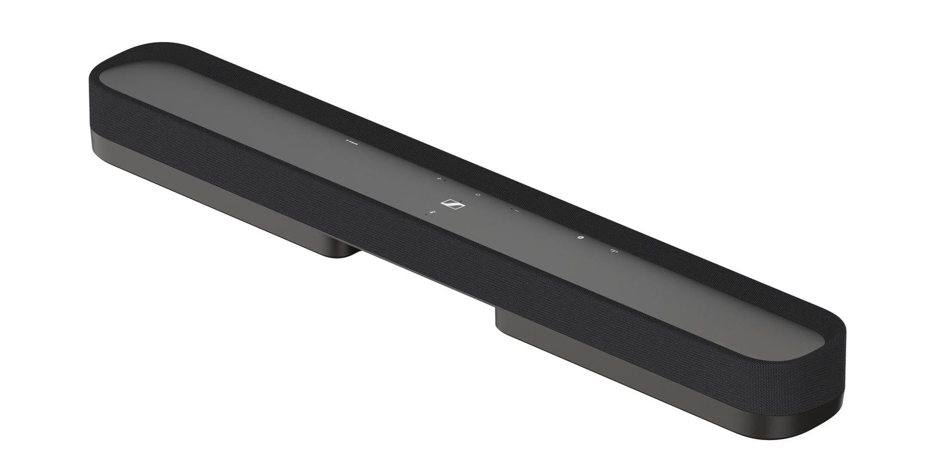 Beyaz zemin üzerinde siyah bir soundbar. Örgü ön yüzü, düğmelerle düz bir üst kısmı ve iki küçük ayağı var.