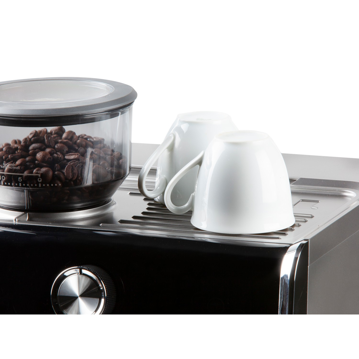 Coffee machine with beans, two white cups on top, and a tray.