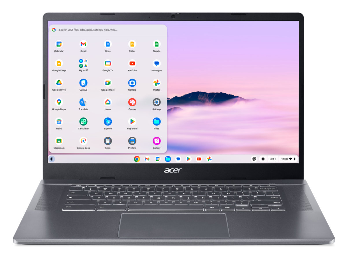 Laptop pokazujący ekran Google Chrome z wieloma ikonami aplikacji. Laptop jest szary i na białym tle.