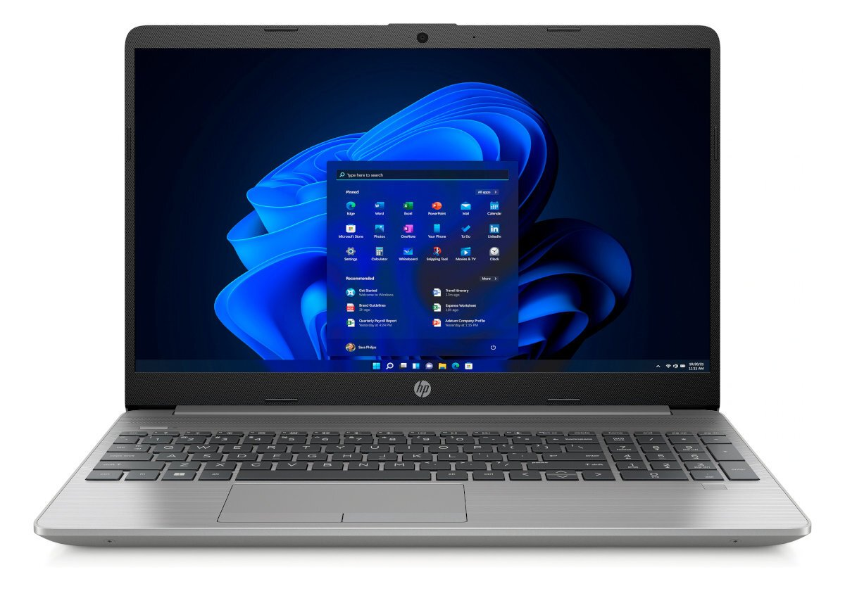 Srebrny laptop otwarty, pokazujący interfejs Windows 11. Widoczne ikony aplikacji i tło pulpitu.