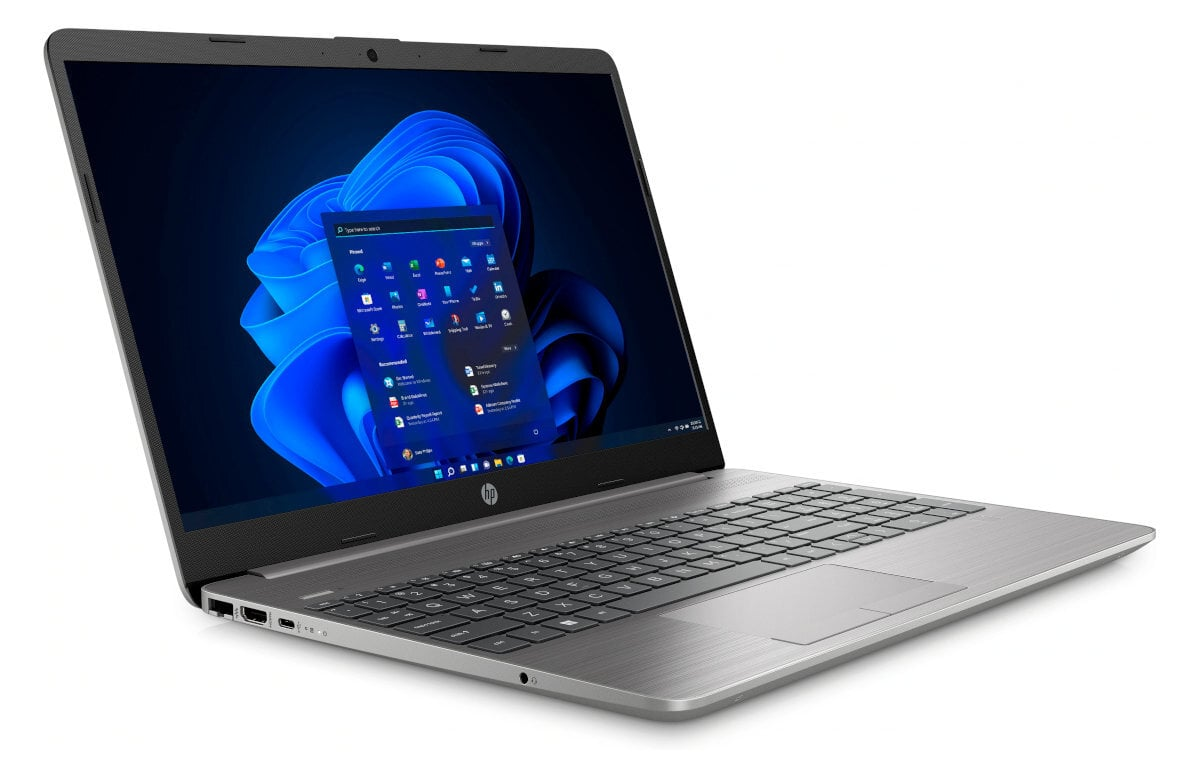 Szary laptop na białym tle. Ekran pokazuje interfejs systemu Windows.