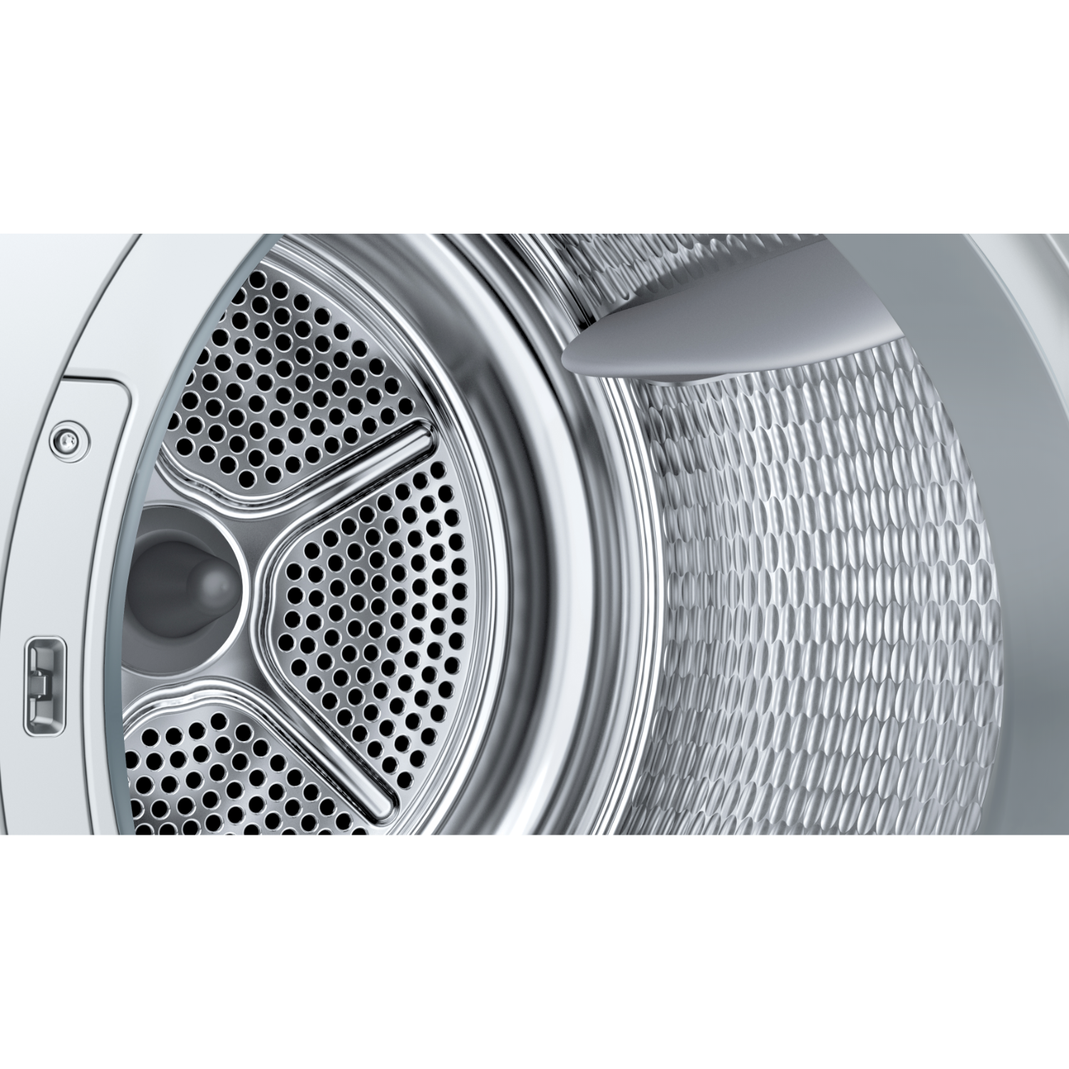 Binnenin een wasmachine. Een geperforeerde metalen trommel. Close-up weergave in de machine.