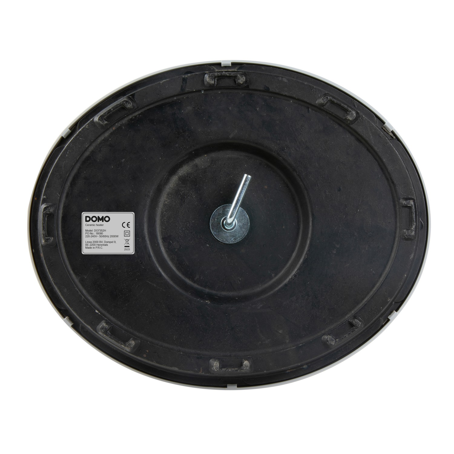 Underside of a white and black appliance with a metal screw and a product label.