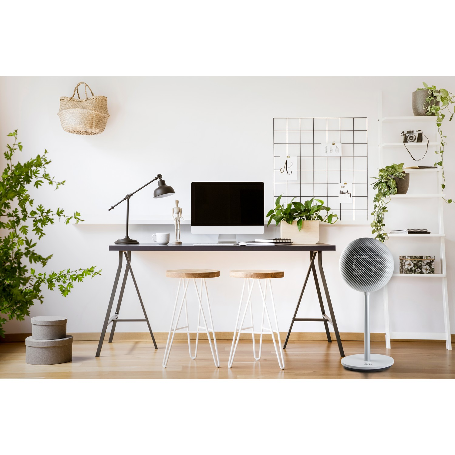 Interior scene with a desk, chairs, plants, and a fan. Bright, modern aesthetic.