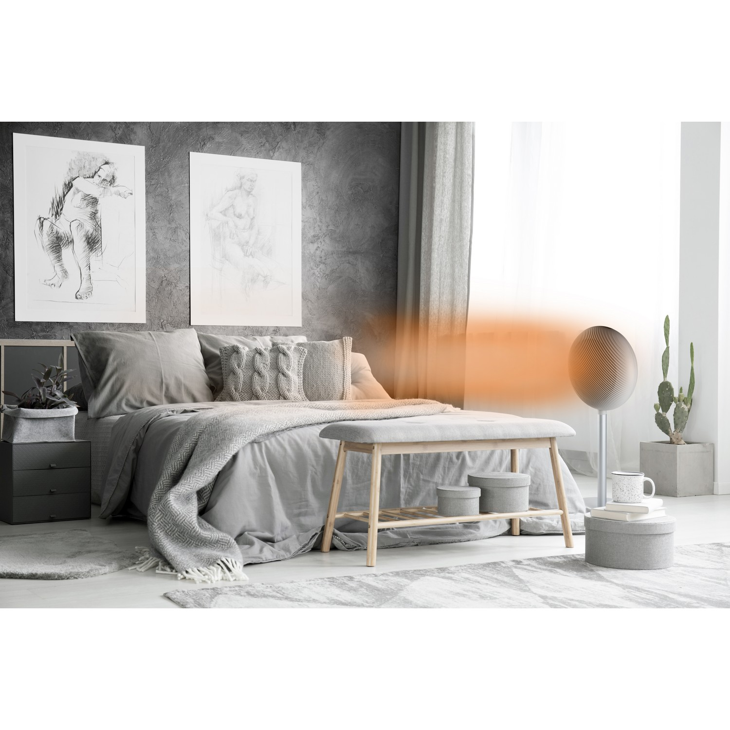 Bedroom with bed, bench, and a speaker. Two pictures on the wall, a grey color scheme.