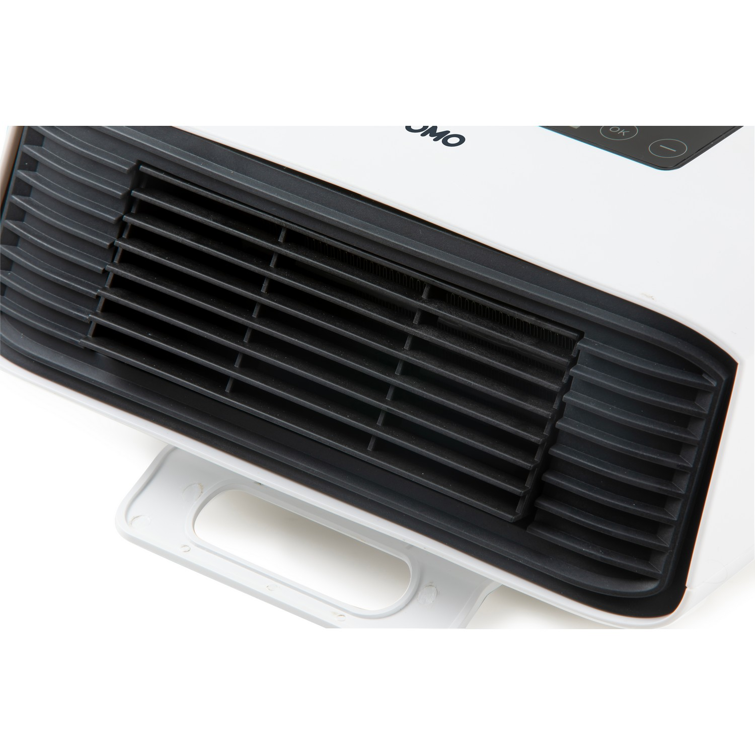 Close-up of a white heater with a black grill, a handle, and the word JMO on the front.