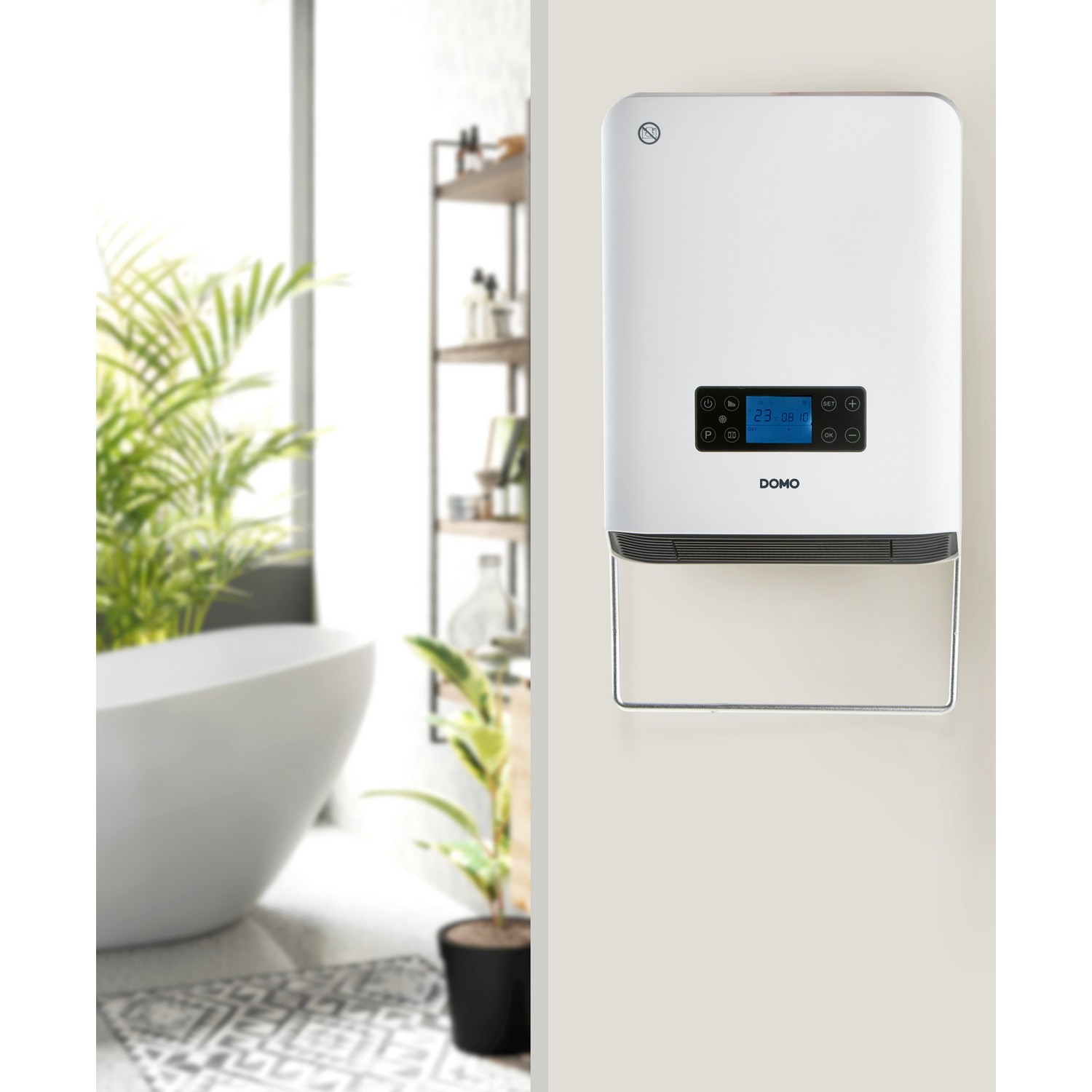White wall-mounted device with a digital display. Bathroom with a tub and a plant is in the background.