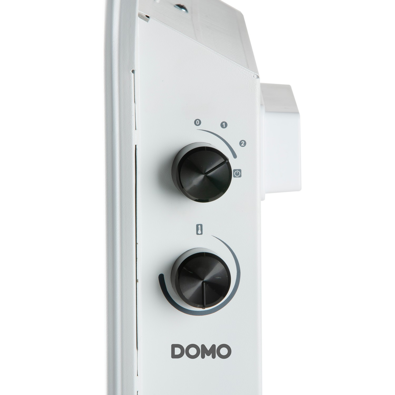 Close-up of a white heater control panel with two black knobs and the word "DOMO".