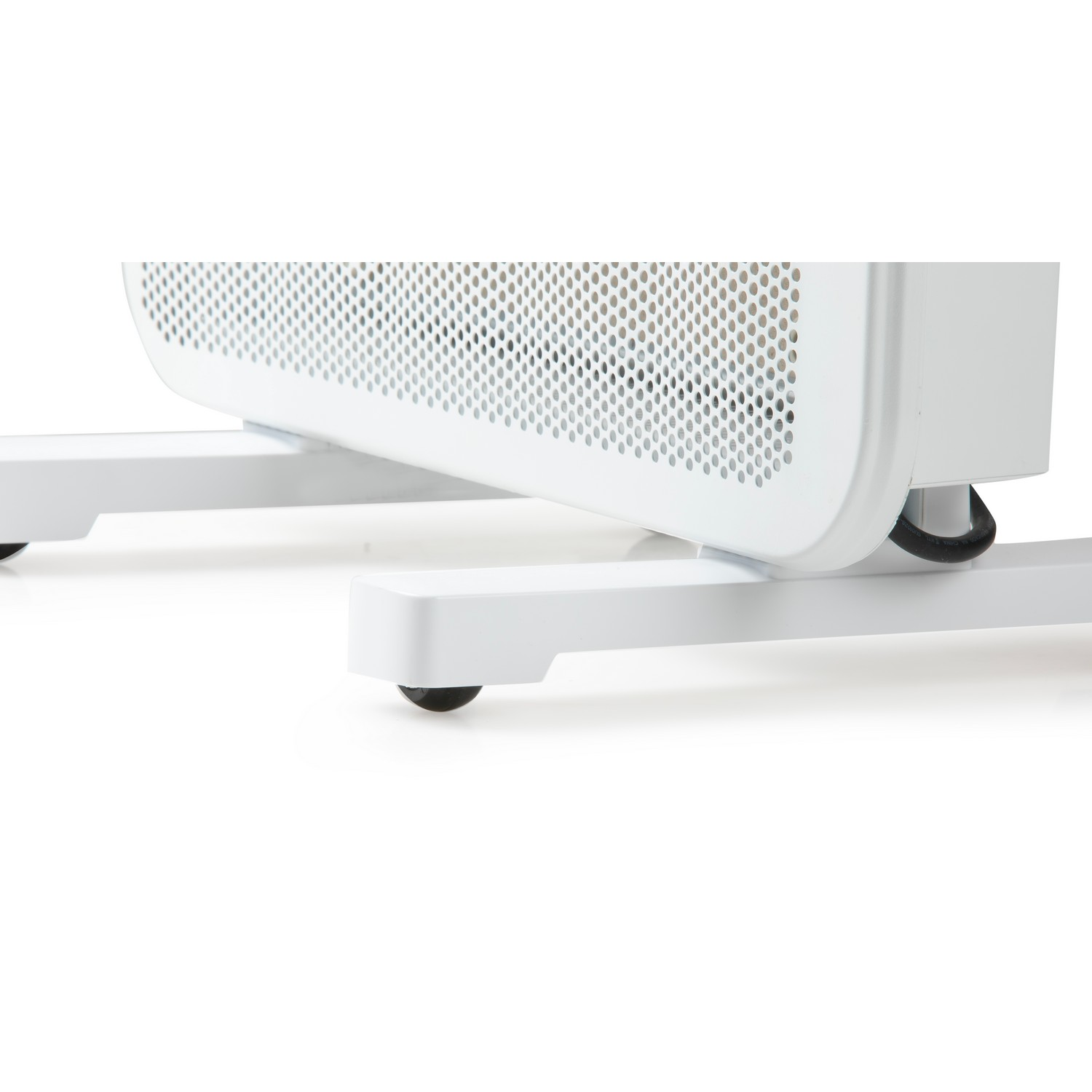 Close-up of a white radiator heater base with small black wheels. White background. Perforated metal surface.