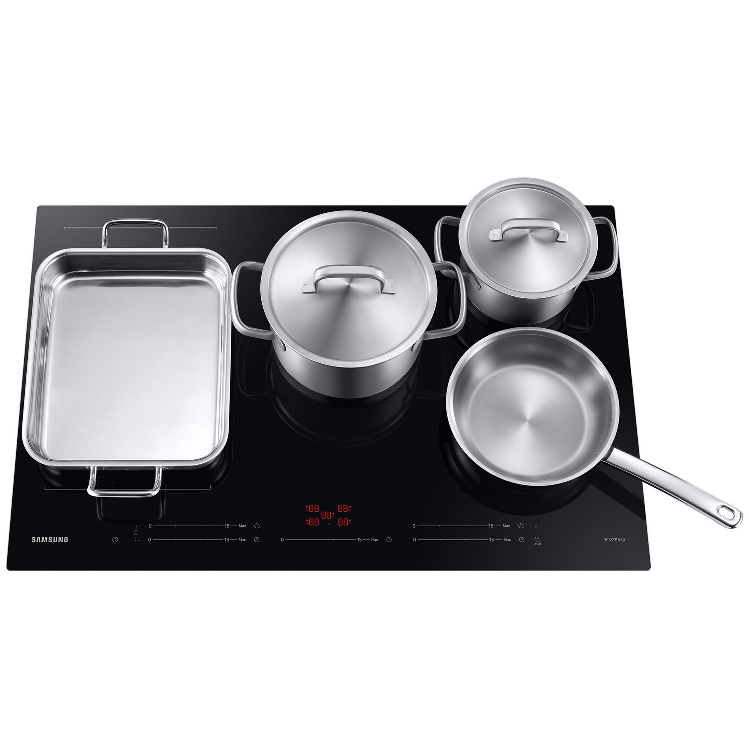 Black stovetop with stainless steel pots and a baking tray.