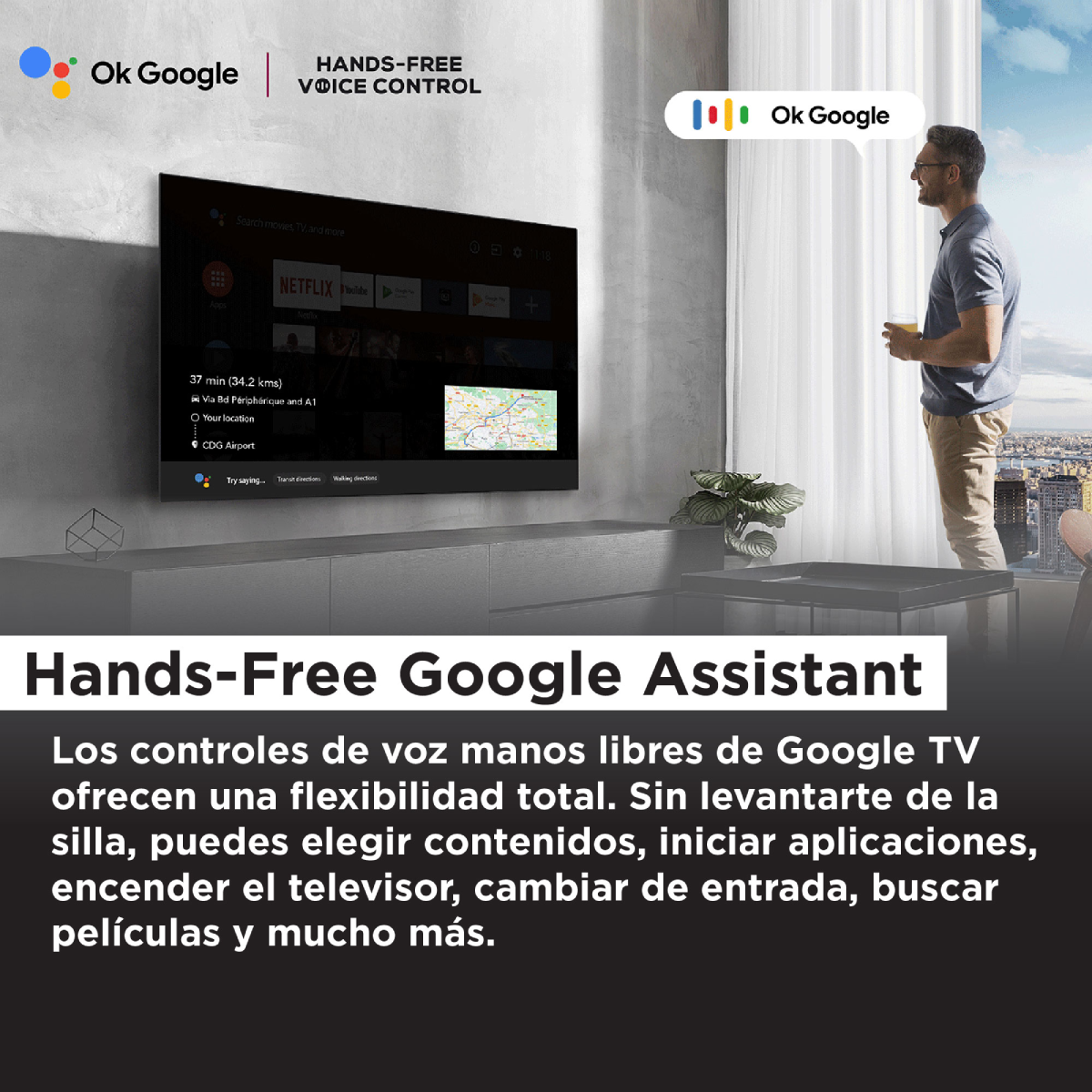 Una escena de sala de estar con un hombre mirando un televisor que muestra el Asistente de Google.