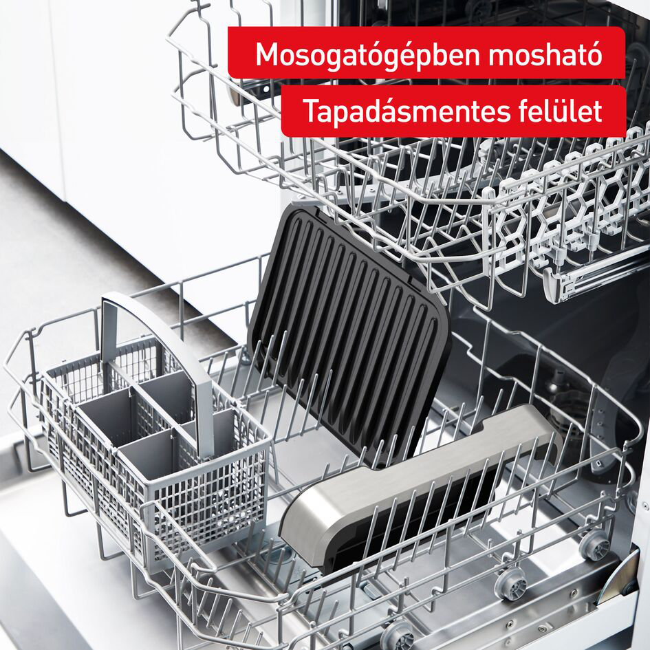 Egy mosogatógép fekete grillsütővel és ezüst fogantyúval. Piros szöveg felül.