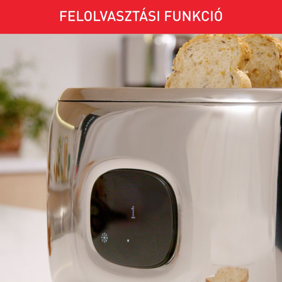 Króm kenyérpirító közelképe kenyérrel. Fekete képernyő, hópehellyel és ponttal.