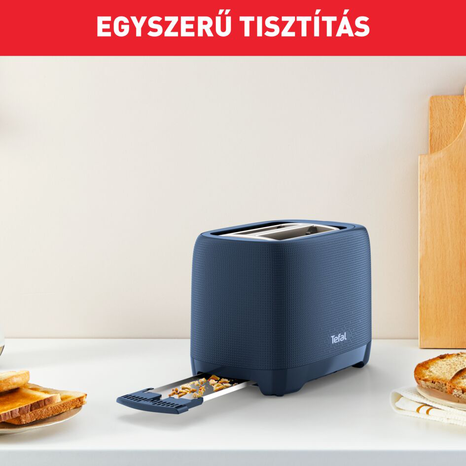 Kék kenyérpirító, rajta a 'KÖNNYŰ TISZTÍTÁS' felirattal. A háttérben kenyér és vágódeszkák.