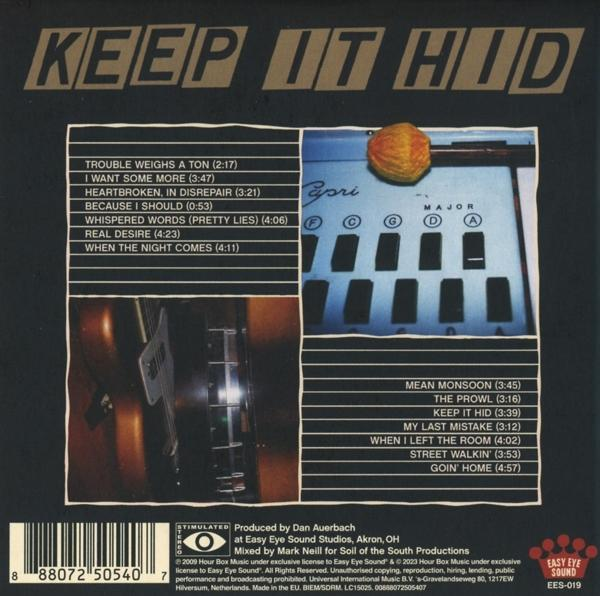 Rückseite einer CD-Hülle. Listet Songtitel, eine Tastatur und andere Musikinstrumente.