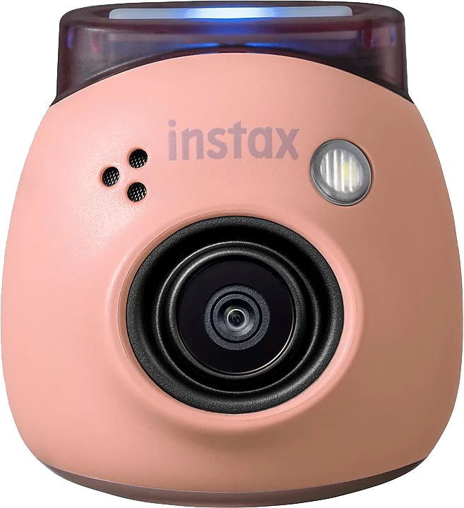 Rózsaszín Instax kamera fekete lencsével és vakuval a tetején.
