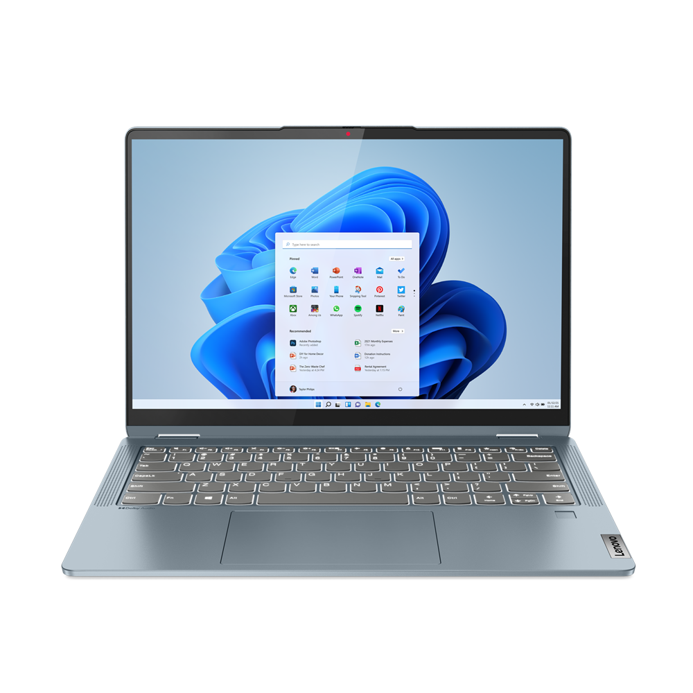 Portátil Lenovo azul abierto, mostrando Windows 11. Teclado visible.