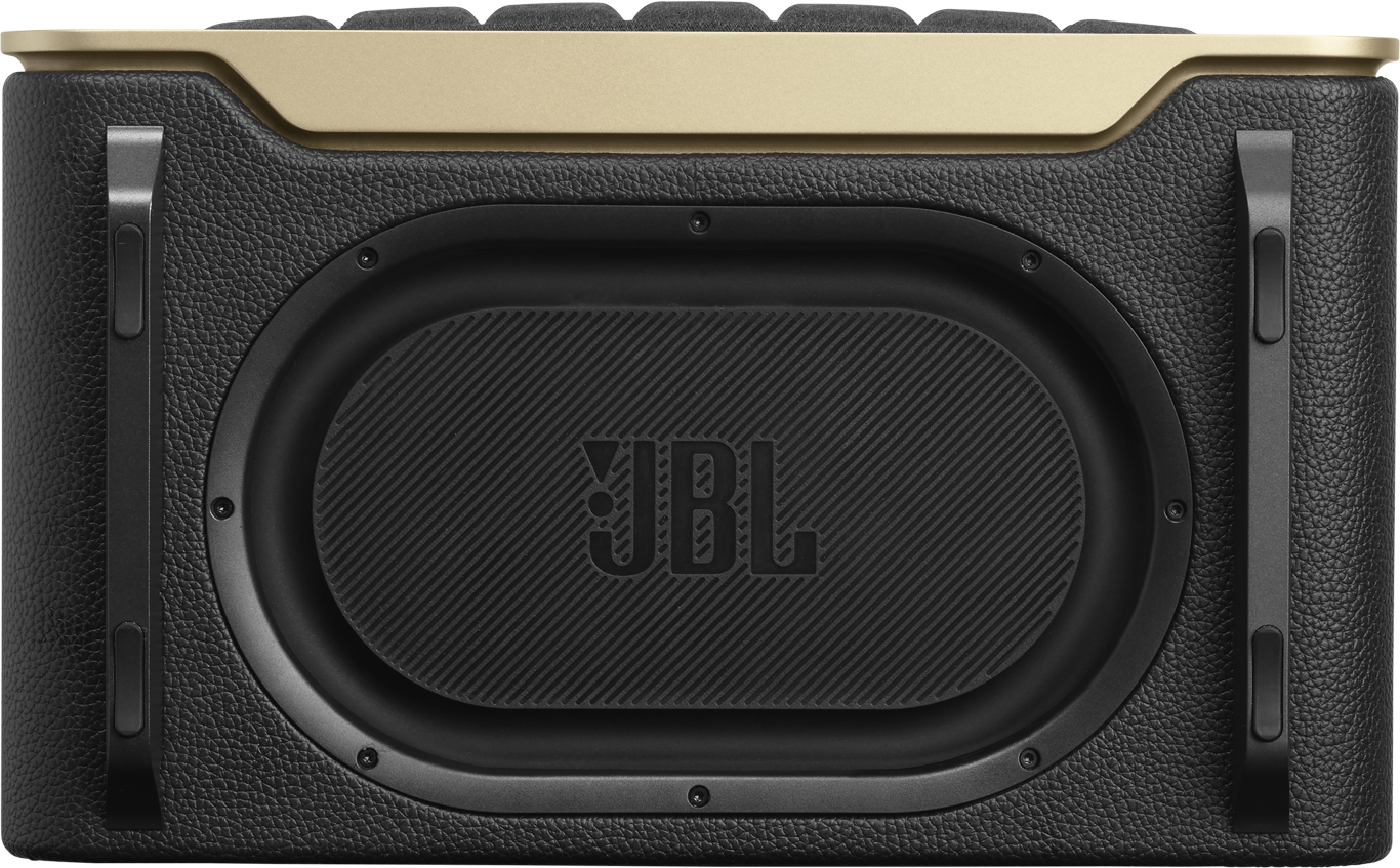 Un haut-parleur JBL noir avec le dessus doré et des poignées noires. Le haut-parleur porte le logo JBL.