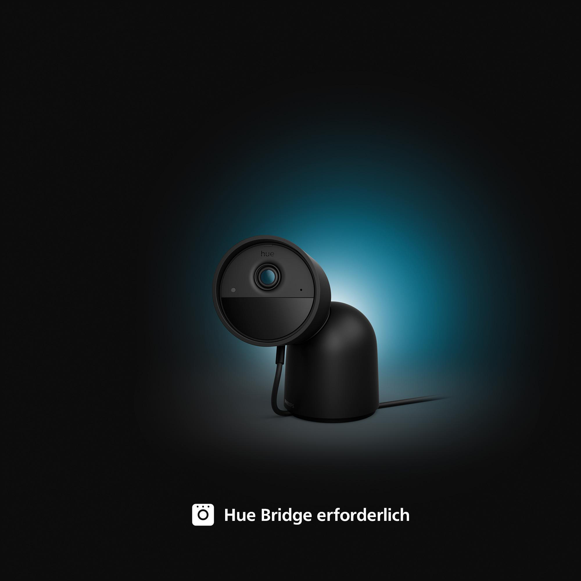 Schwarze Smart-Home-Sicherheitskamera mit schwarzer Basis, auf schwarzem Hintergrund.