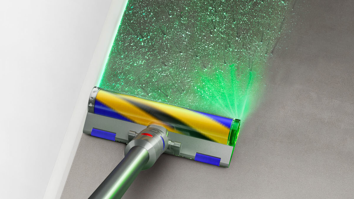 Głowica odkurzacza na szarej powierzchni. Zielone światło jest wyświetlane na powierzchni.