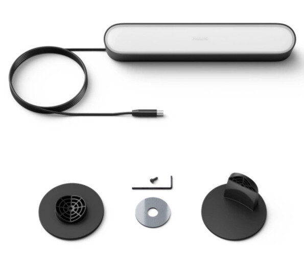 Widok z boku białego laptopa na czarnym tle.