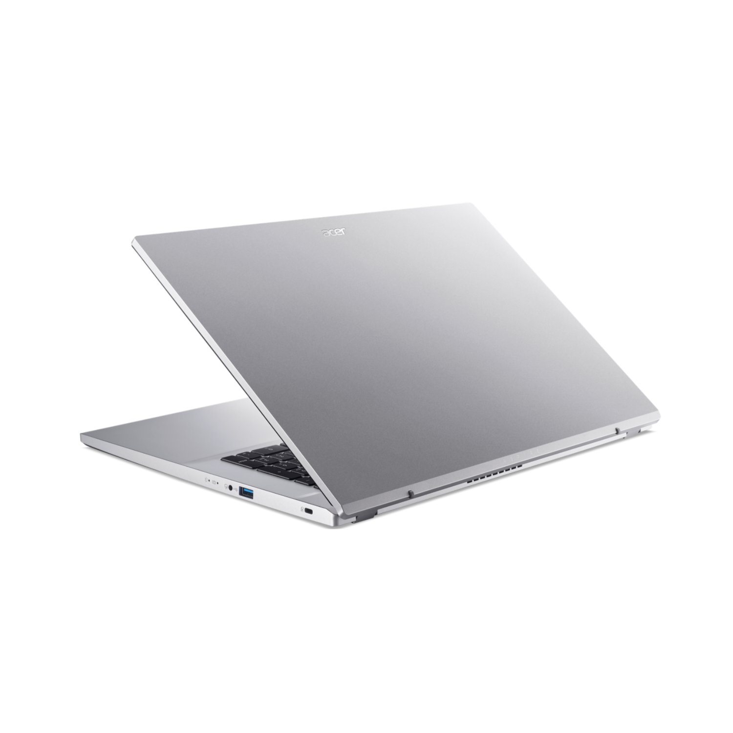 A silver laptop with the screen open on a black background.