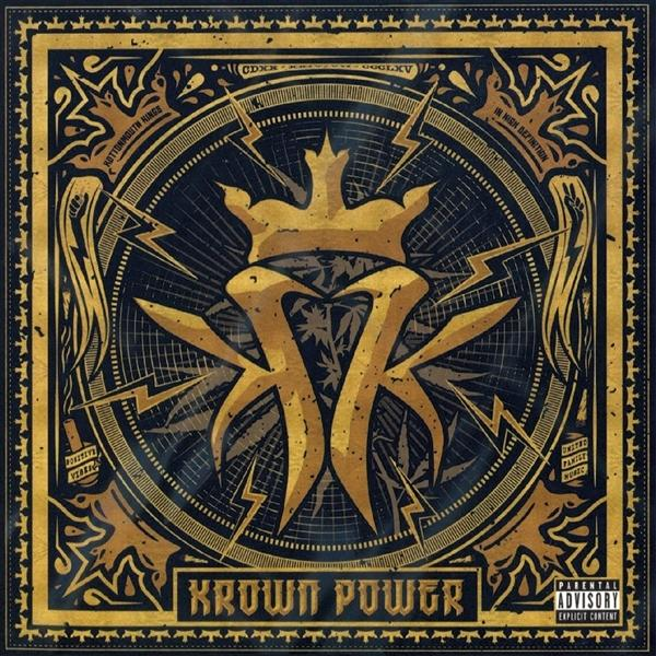 Albumcover mit goldener Krone und Blitz auf schwarzem Hintergrund mit Ornamenten und Text.