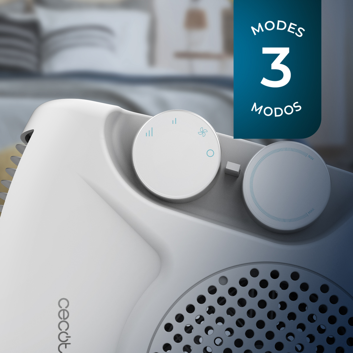 Un ventilador blanco con tres controles de modo. Una cama borrosa en el fondo con un cuadro de texto azul.