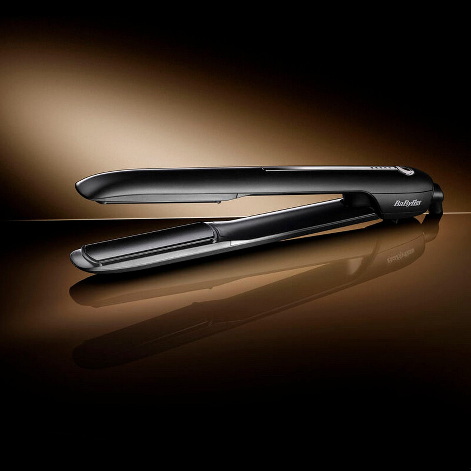 Black hair straightener, shiny surface, dark background, reflection.