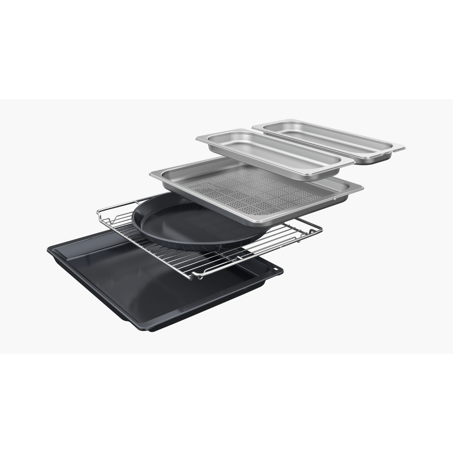 Various metal baking trays and racks stacked on a white surface.