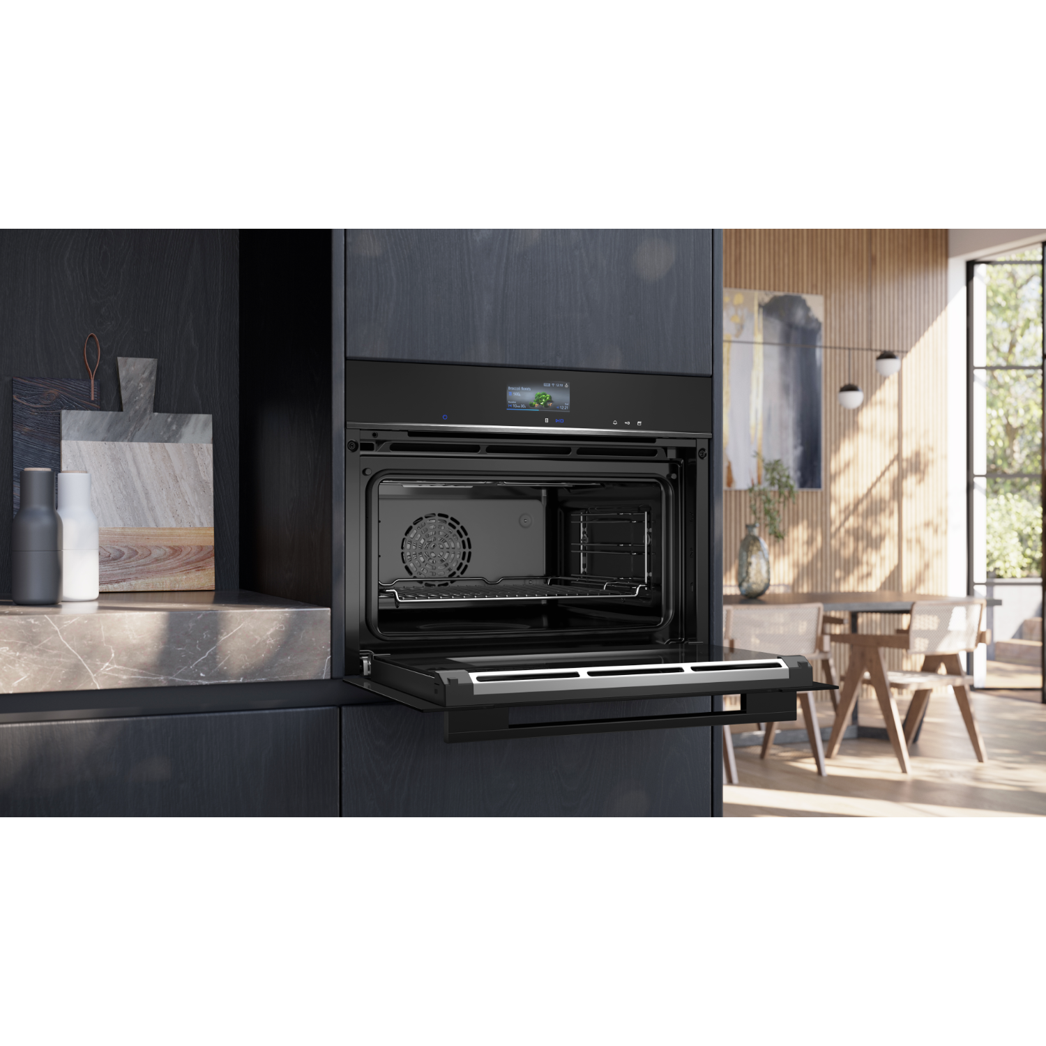 Black oven with door open, inside is visible. In a kitchen setting.