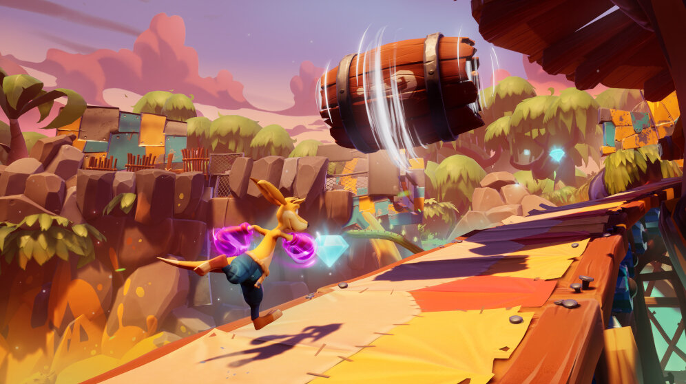 Kreskówkowy kangur skaczący nad drewnianą beczką w kolorowym otoczeniu.