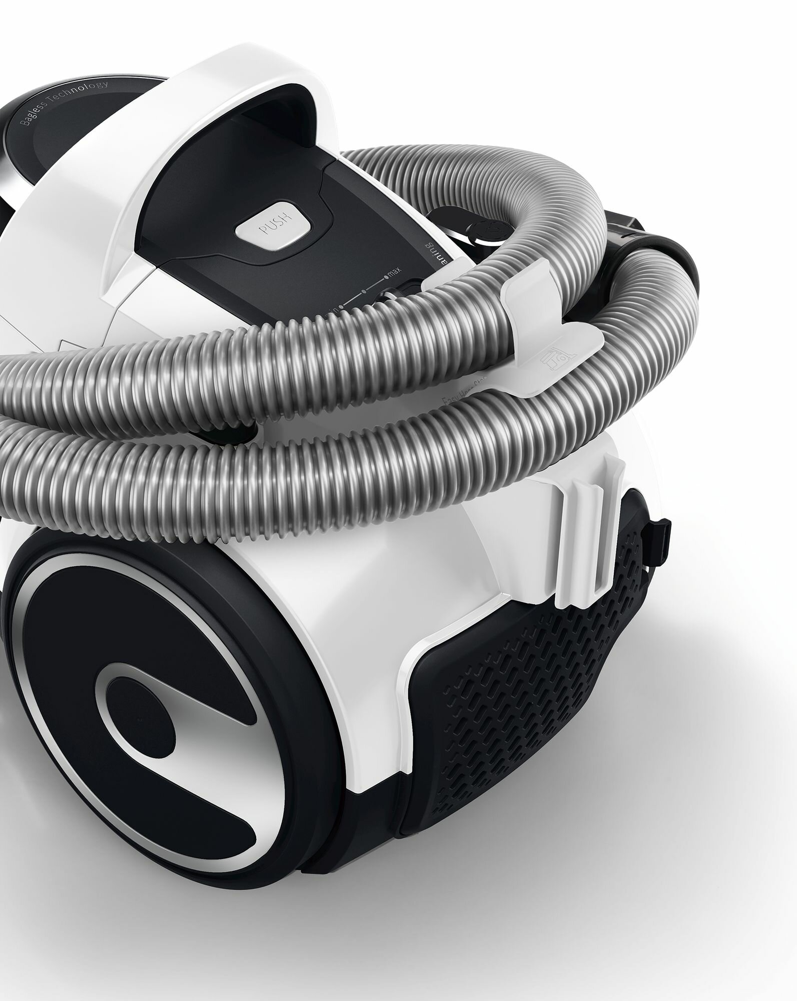 Biało-czarny odkurzacz ze zwiniętym wężem. Zbliżenie na bok urządzenia.