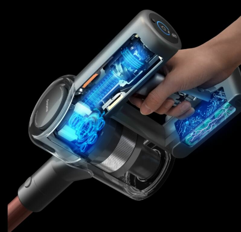 Widok przekrojowy szarego i czarnego odkurzacza bezprzewodowego, pokazujący elementy wewnętrzne i dłoń.