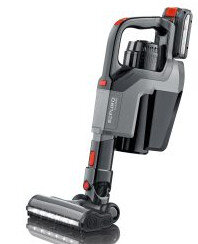 Mały, ręczny odkurzacz. Jest szary i czarny z czerwonymi akcentami. Jest lekko pochylony w prawo.