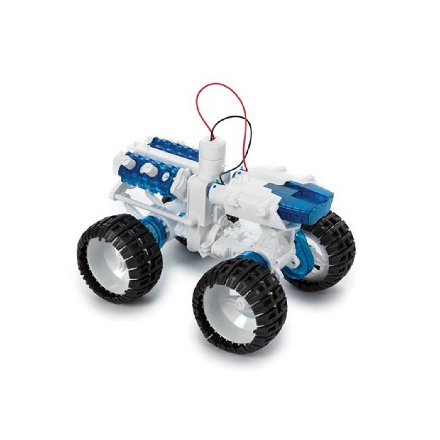 A toy car with a blue engine and large black tires is on a white surface.
