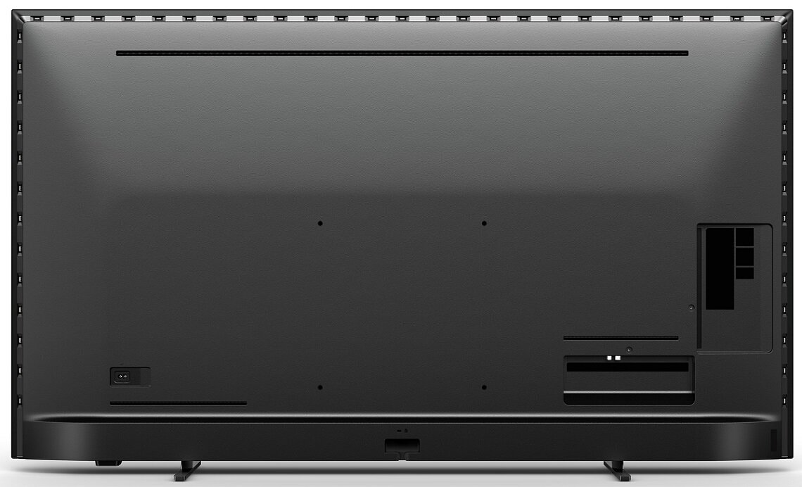 Tył czarnego telewizora, pokazujący porty i podstawę.
