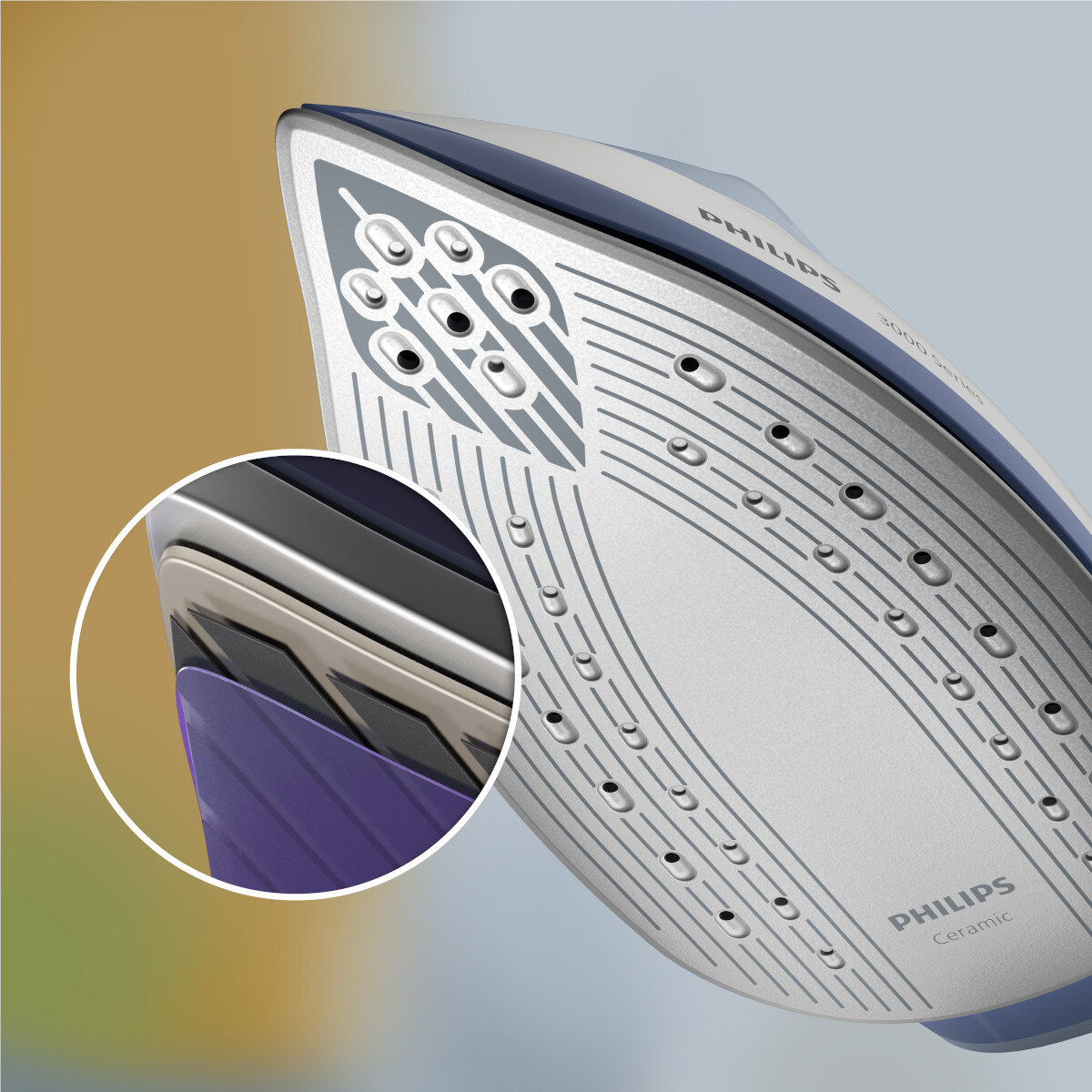 Zbliżenie żelazka ceramicznego Philips. Powiększony fragment żelazka, pokazujący warstwy.