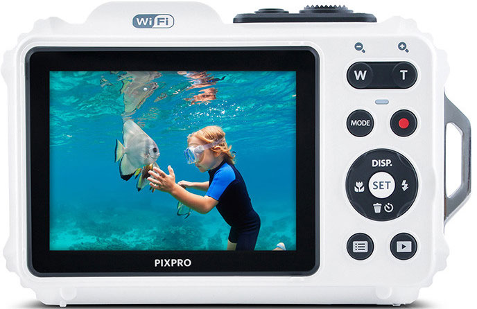 A white waterproof camera showing a child snorkeling in the sea, with a fish, in front of the screen.