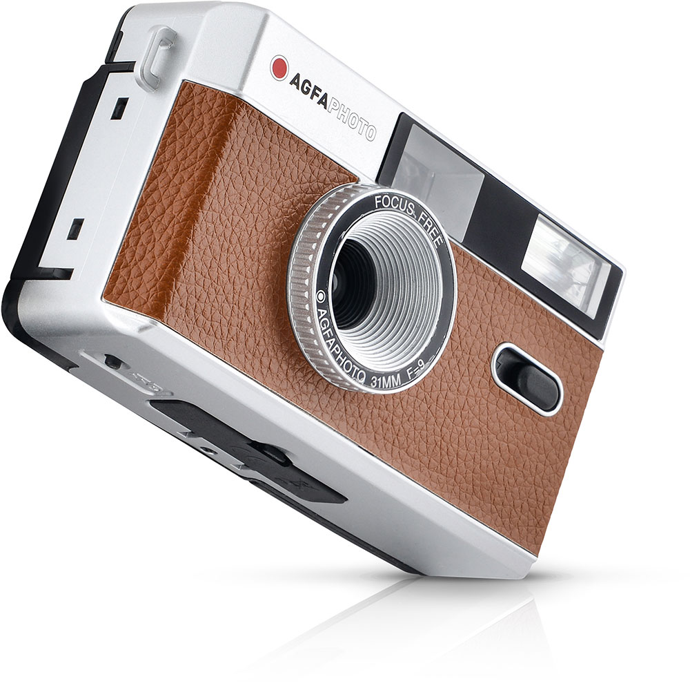 A retro camera with a brown leather finish. The lens says "AGFA PHOTO".