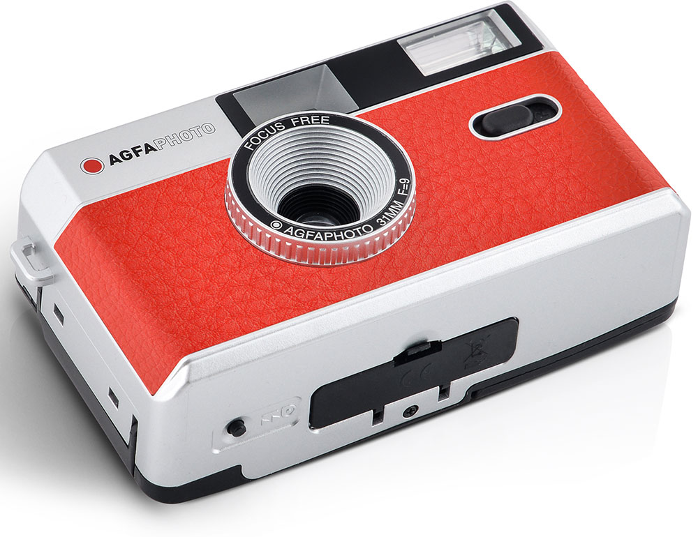 Red and silver AGFA camera, lens in front, black button, flash at top, white background.