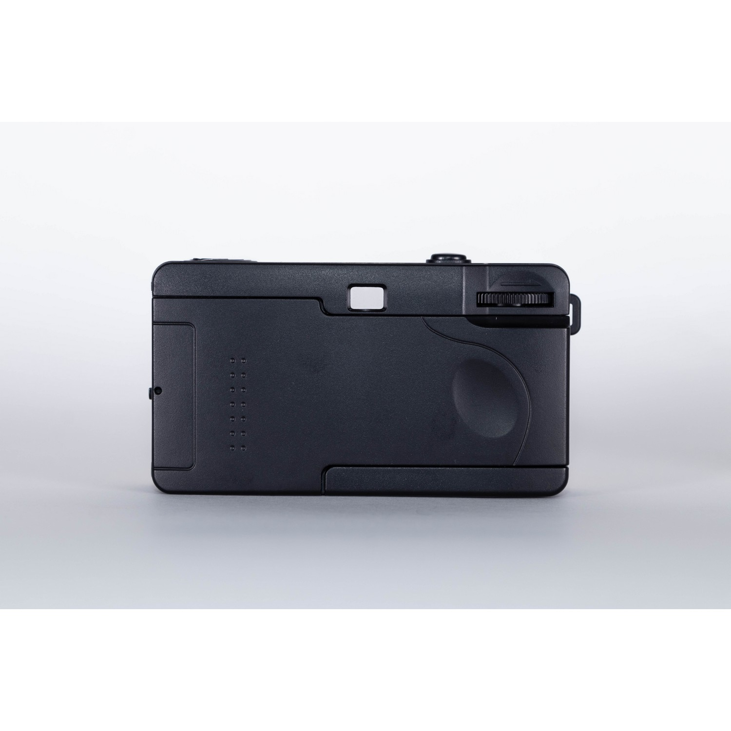 Black camera with a rectangular body. It has a view finder and a control wheel.