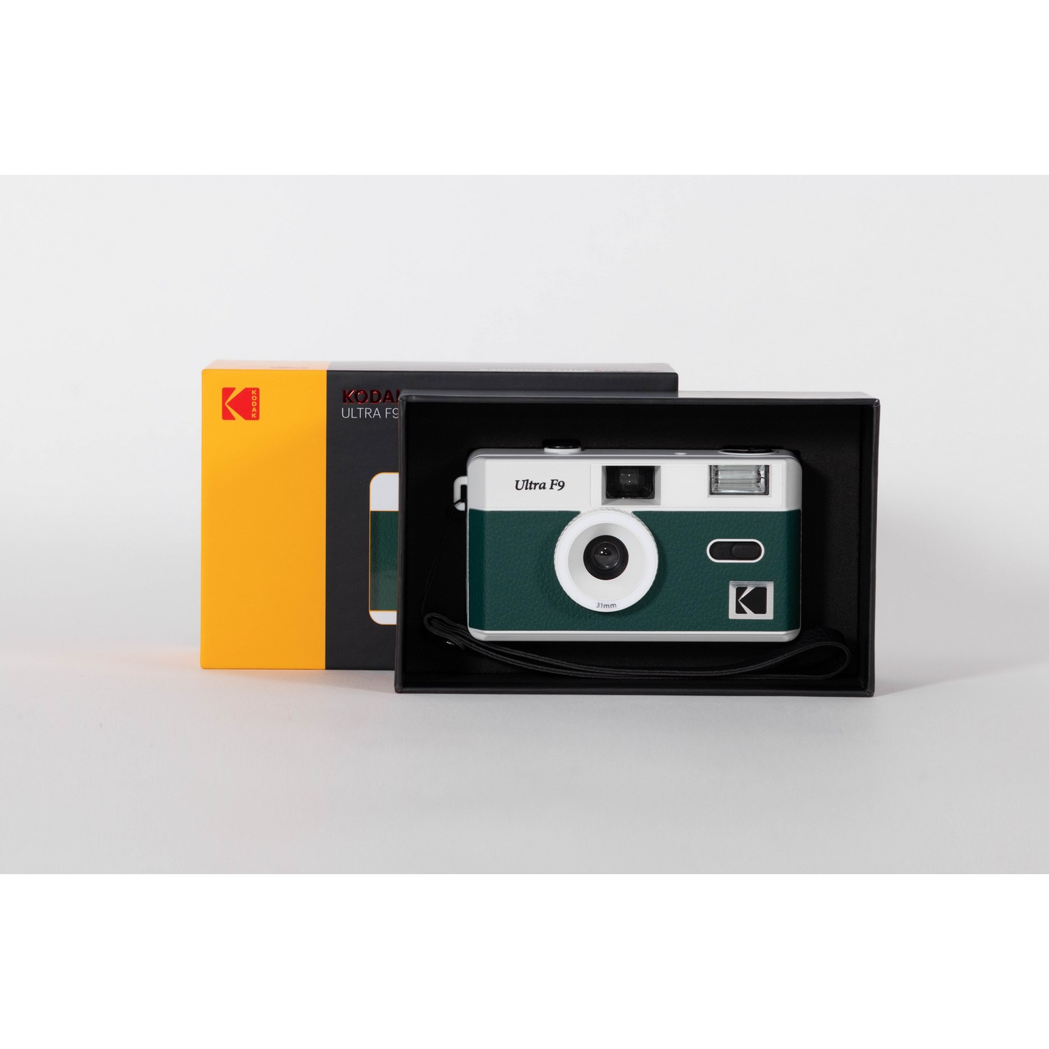 Kodak Ultra F9 camera in a box, with a yellow box next to a black box, white background.